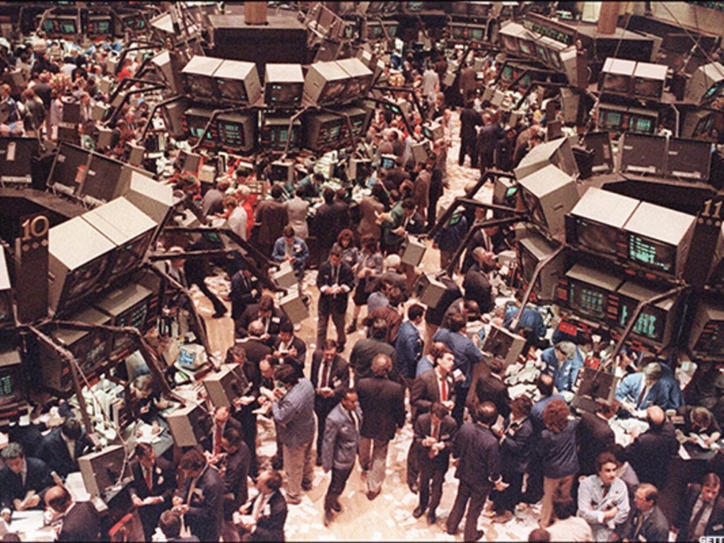 Crowded Wall Street trading floor during the junk bond era